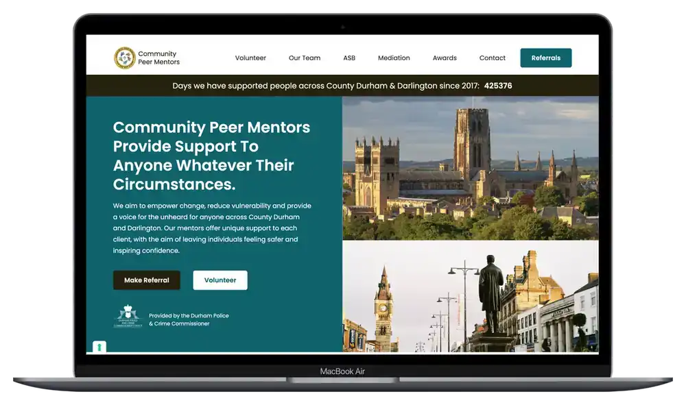 Durham Community Peer Mentors website on a MacBook